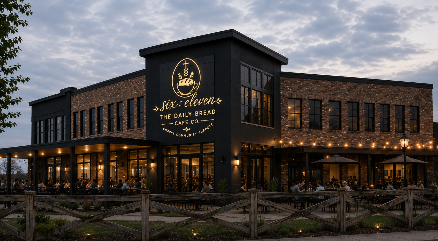 six:eleven — The Daily Bread Cafe Co. two-story exterior at dusk
